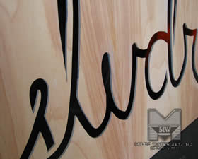 Water jet cut Birchwood Panels with Logo for SLVDR Cothing - Store Front Display
